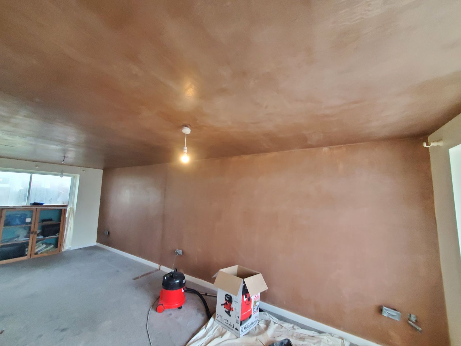 A room freshly plastered with the ceiling skimmed