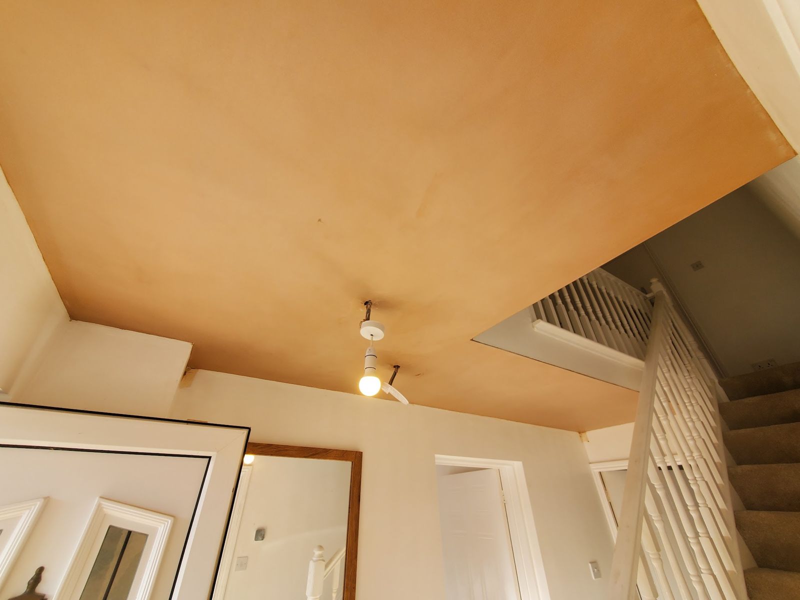 A freshly skimmed ceiling over a stairwell