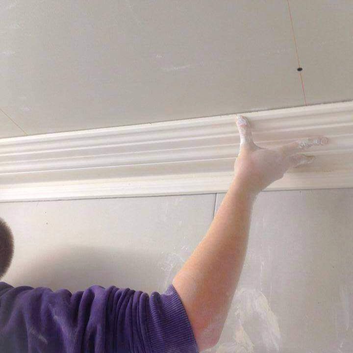 A new length of cornice being matched to the existing