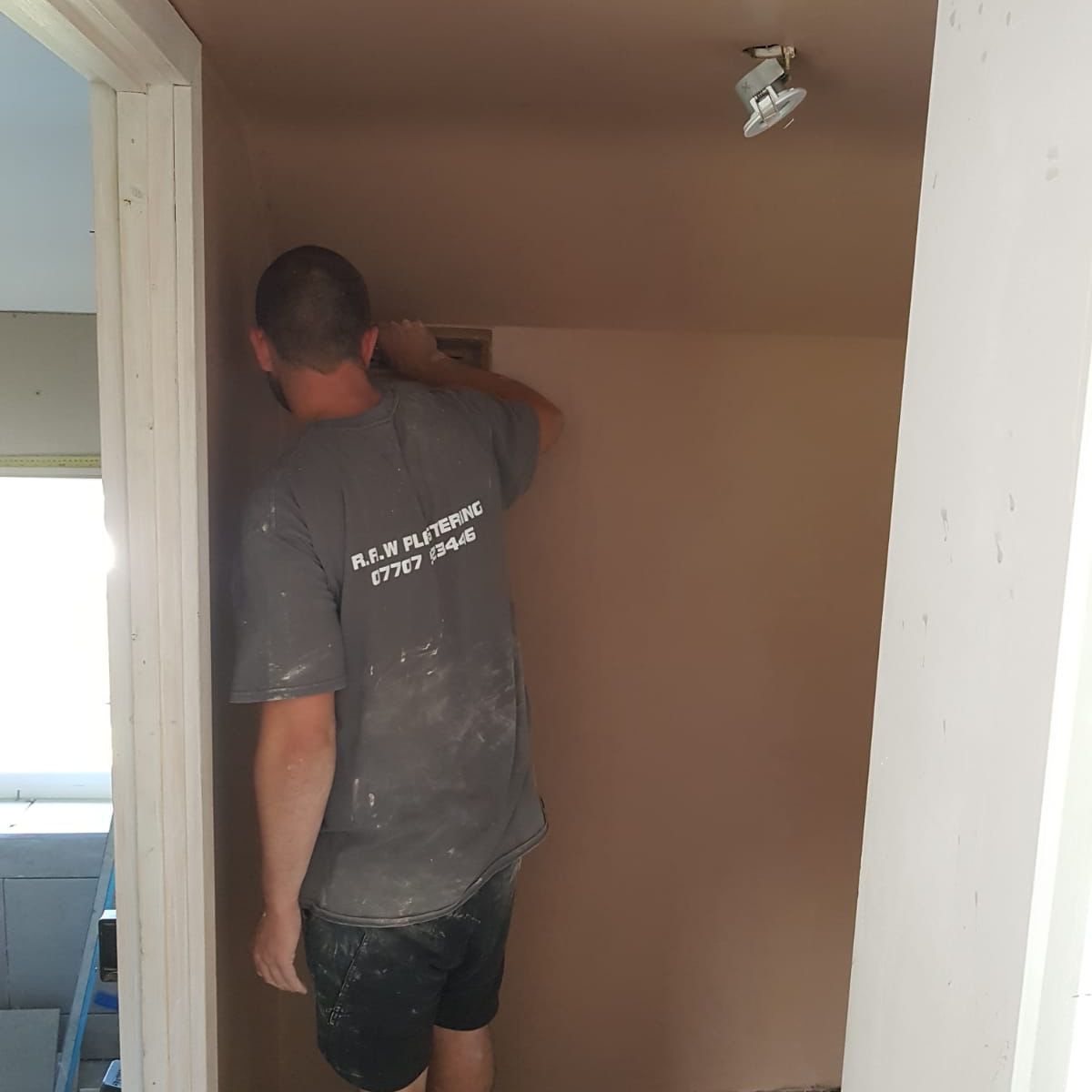 Ryan at work in a RAW Plastering T-shirt