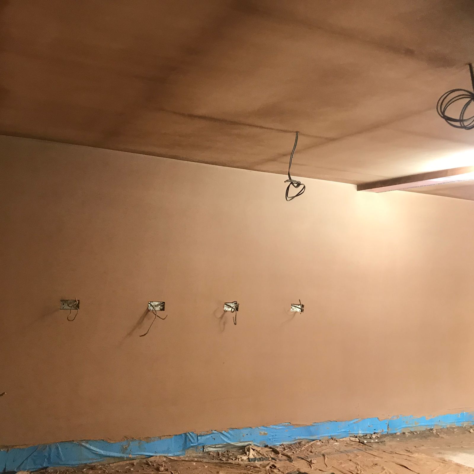 A freshly plastered room with the ceiling done