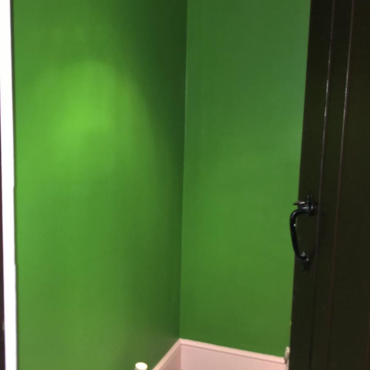 A re-skimmed bathroom painted bright green