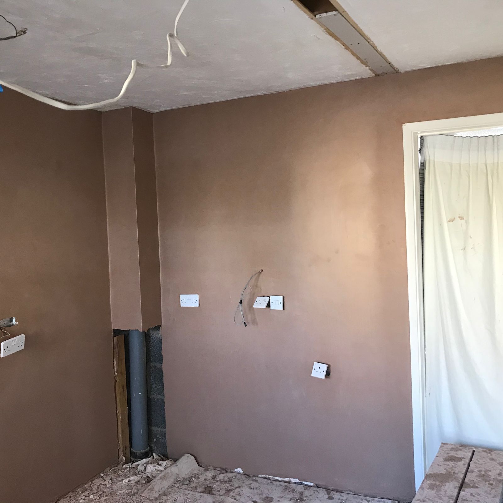 Kitchen walls freshly plastered before a new kitchen goes in