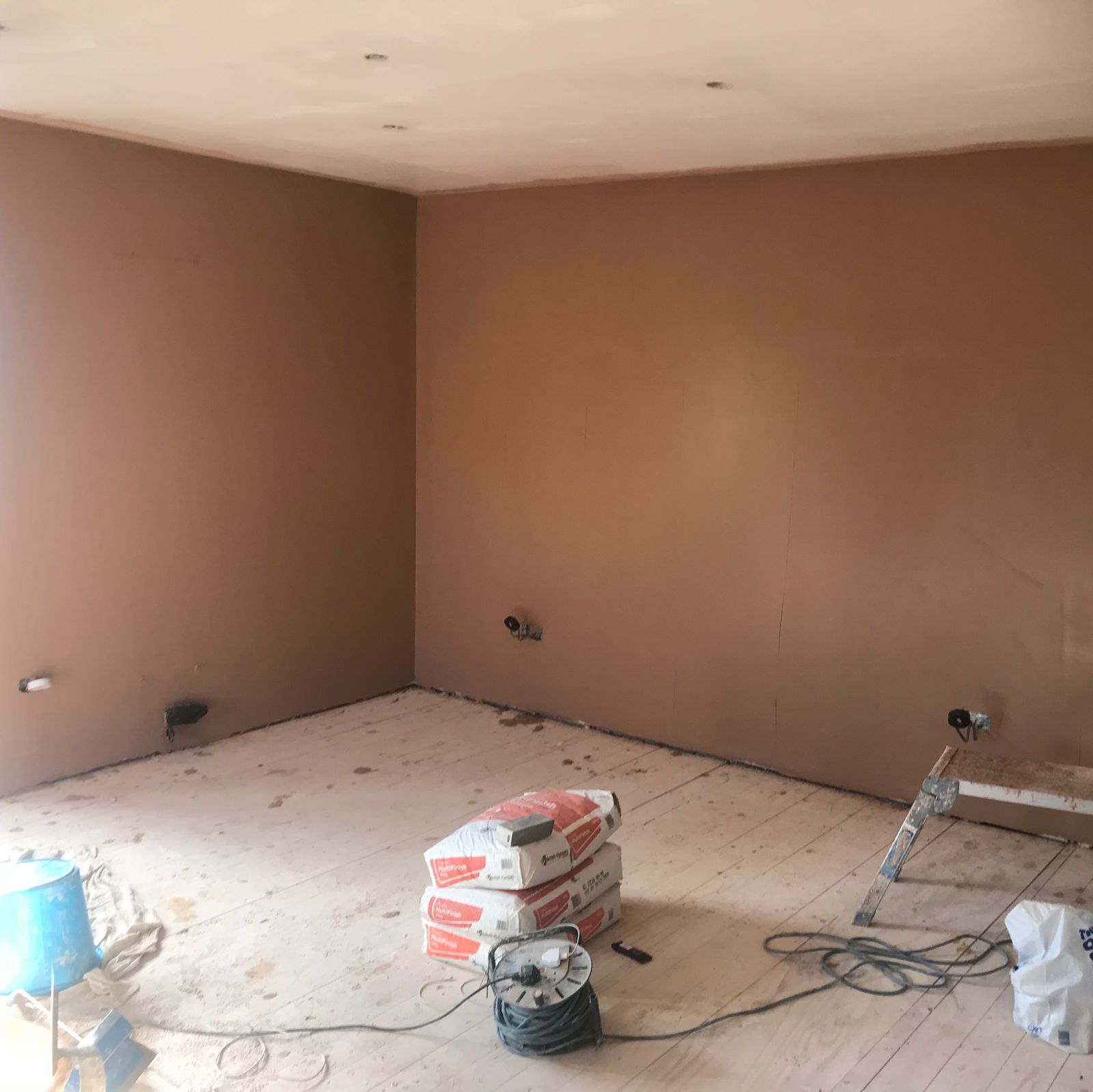 A room reskimmed from floor to ceiling
