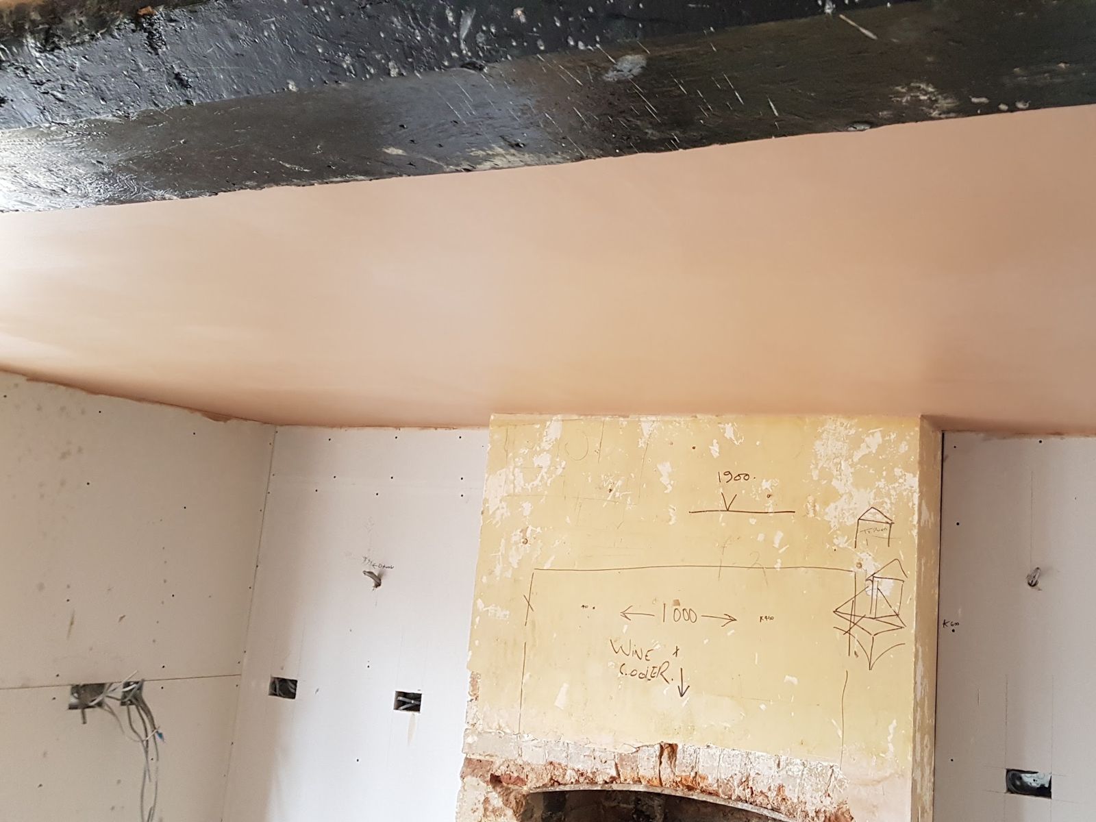 A kitchen ceiling plastered during a refurb