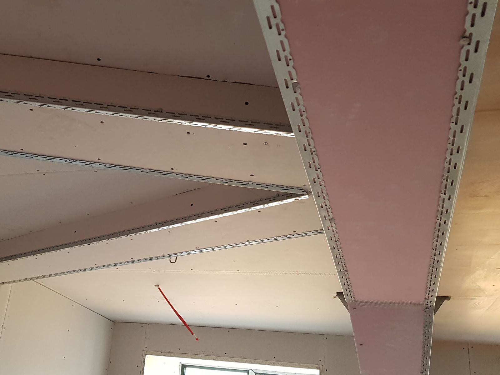 Boxed-in beams boarded with plasterboard and beading